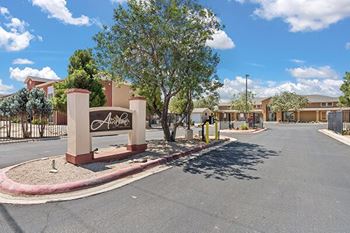 an empty street in front of an apartment building
