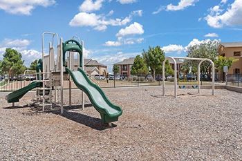 a playground with a slide in a park