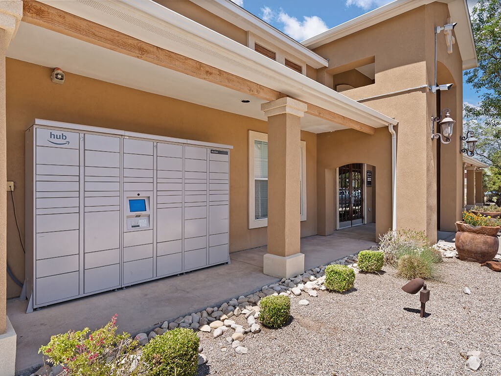A modern house with a garage door and a small garden in front.