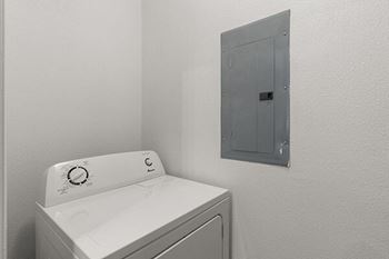 a white washer and dryer in a white room