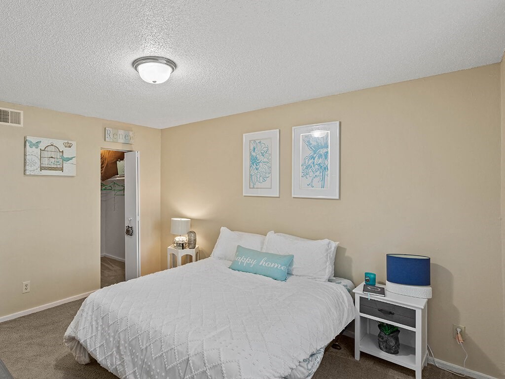 bedroom with a walk in closet