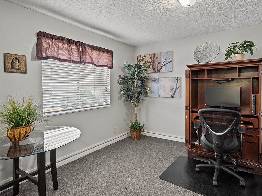 an office with a desk and a chair