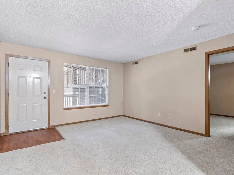 a bedroom with a door and a window