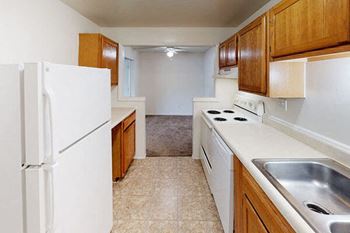 Kitchen with appliances in apartment