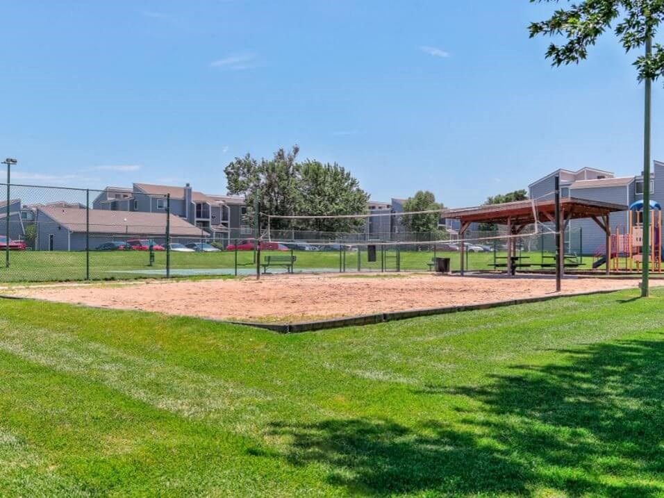 sand volleyball court at Cherry Hills Apartments