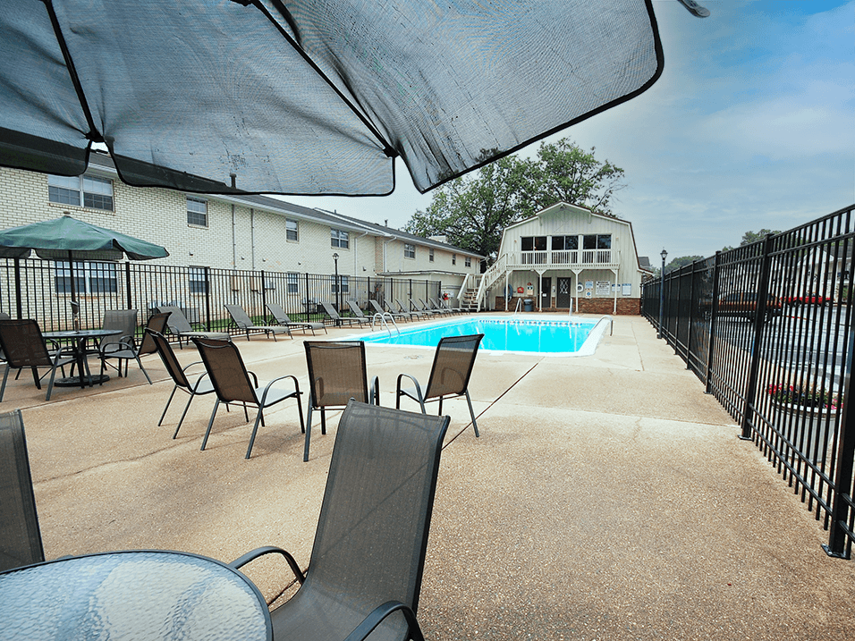 seating area by pool at apartment in evansville