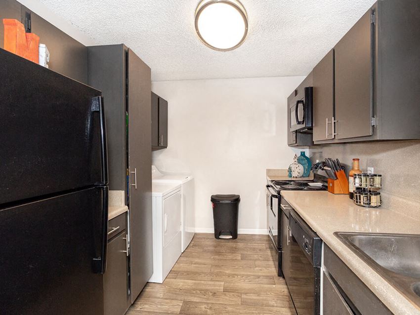 Kitchen with storage area at acadian point apartments - Photo Gallery