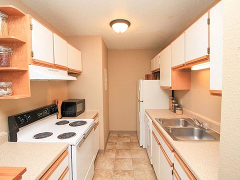 a kitchen with a stove and a sink