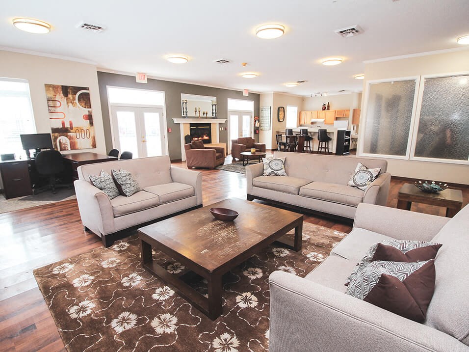 a living room with couches and a coffee table