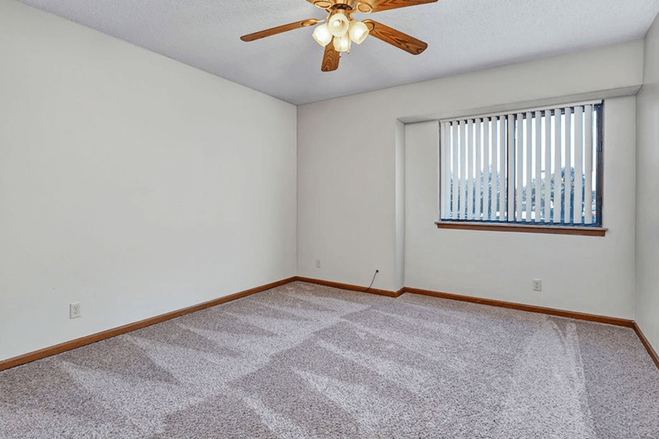 apartment bedroom with ceiling fan