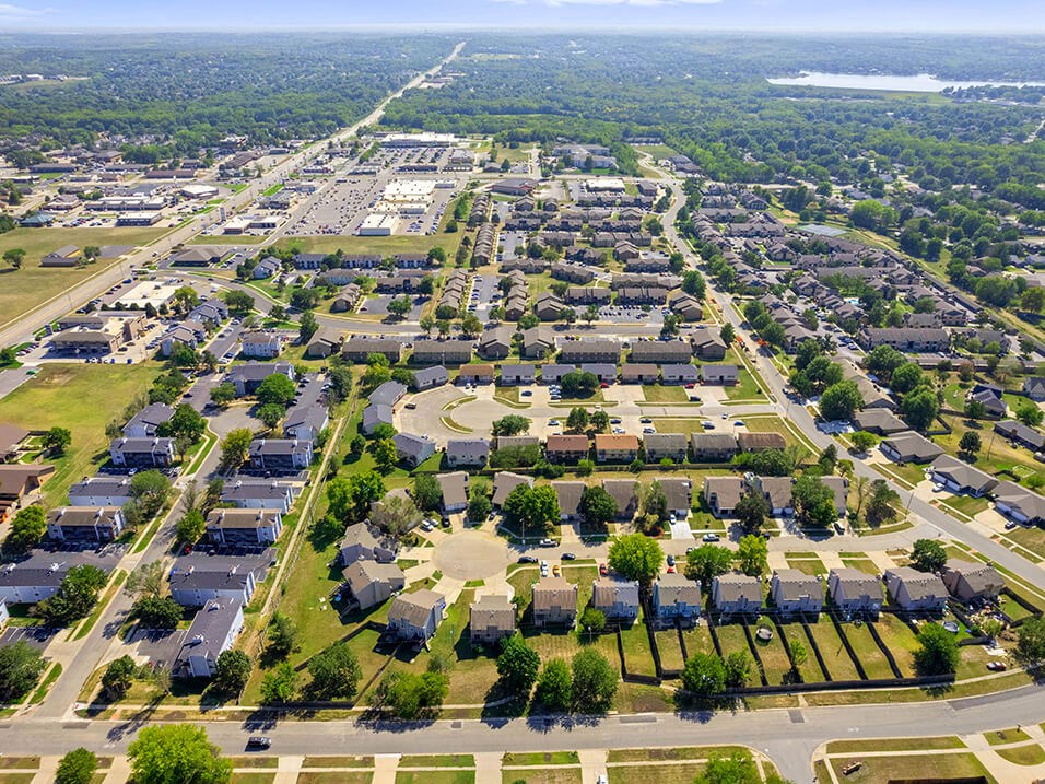 an aerial view of a suburban neighborhood with houses and trees