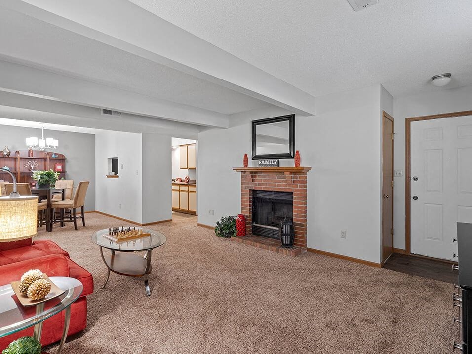 a living room with a fireplace and a couch