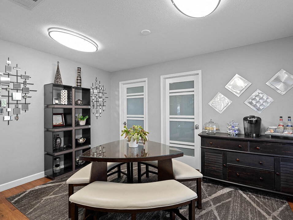 a dining room with a table and chairs