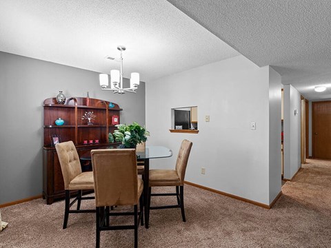 a dining room with a table and chairs