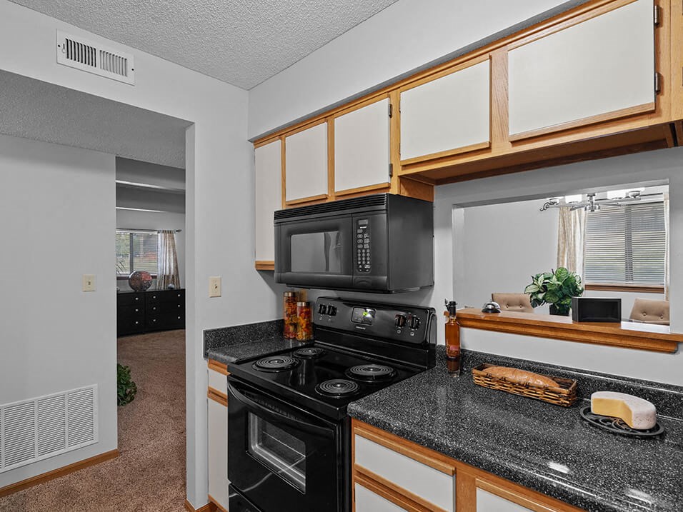 a kitchen with a bunch of microwaves in it