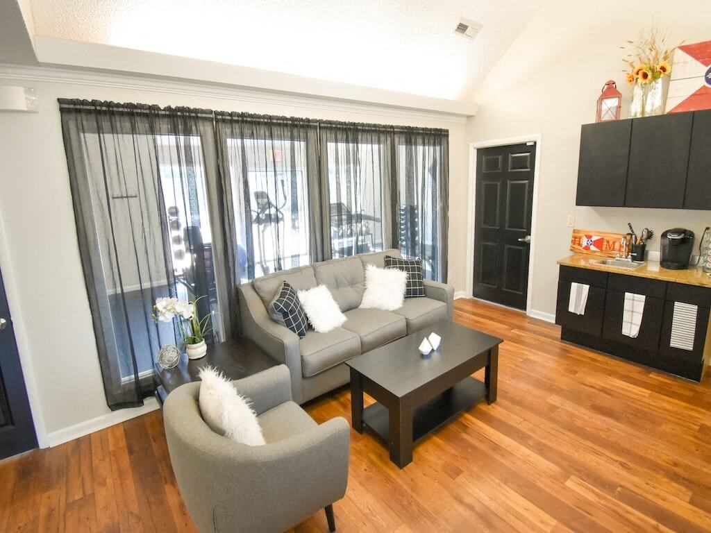 a living room with a couch and a table