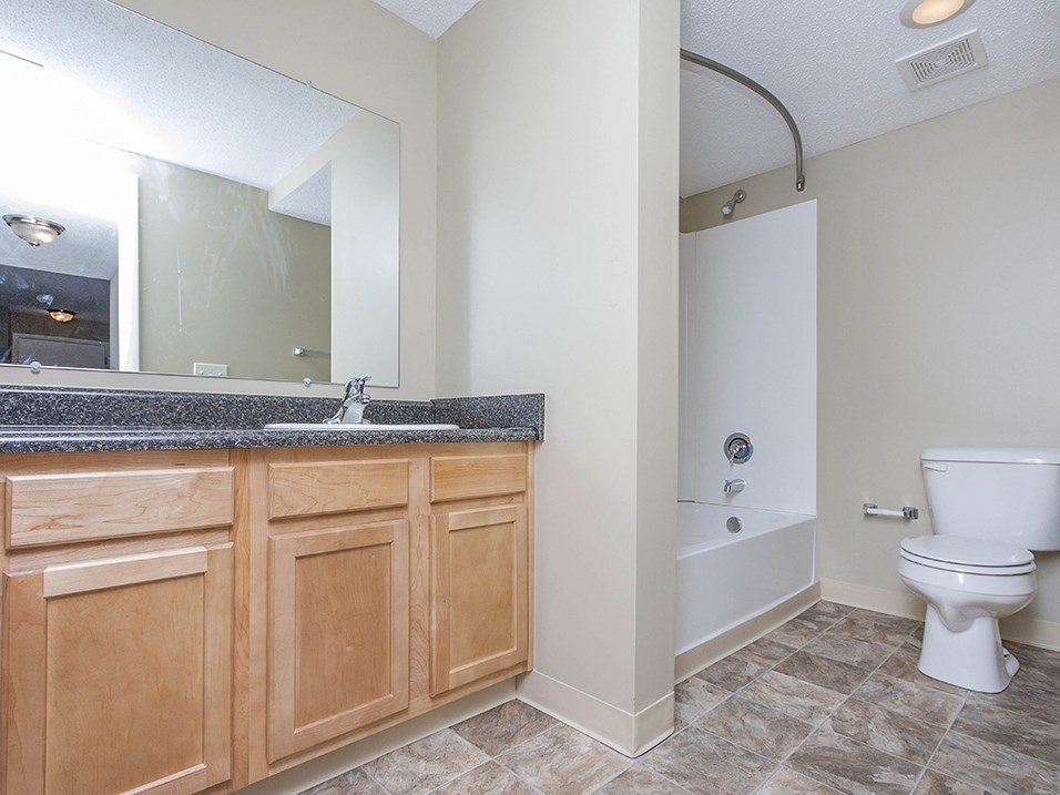 full bathroom with vanity and storage space