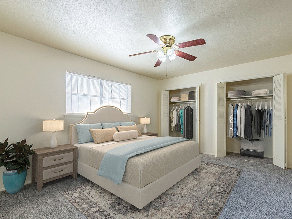 Spacious primary bedroom with two closets and natural light