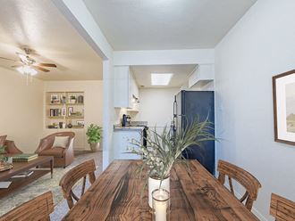 Kitchen and Dining room in apartment at Camelot Apartments