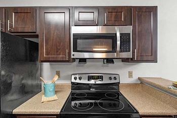a kitchen with a stove and a microwave
