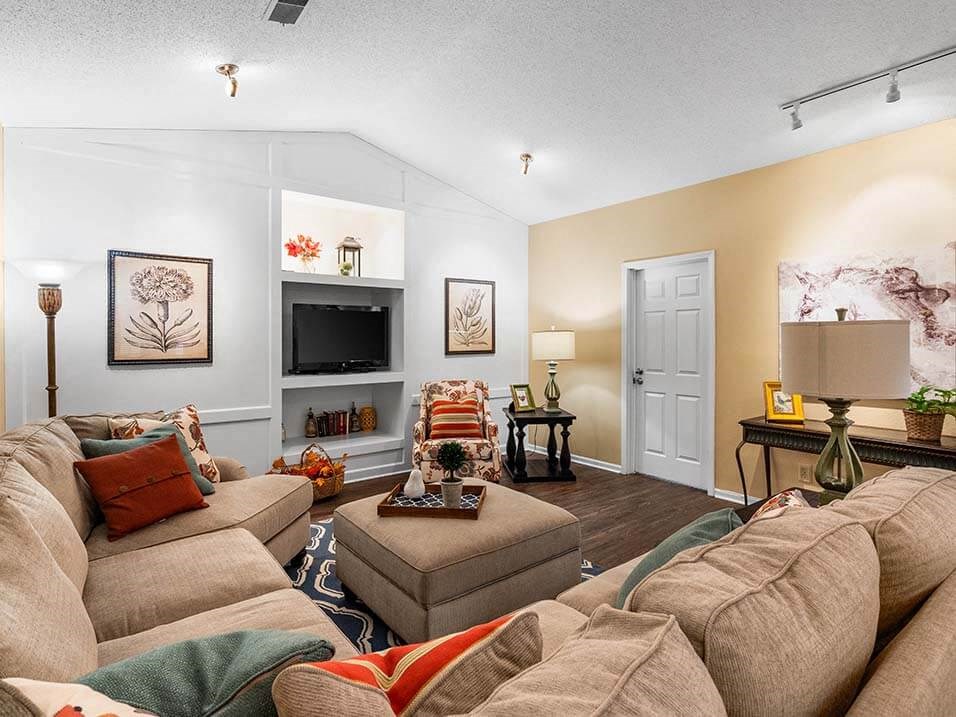 a living room with a couch and a tv