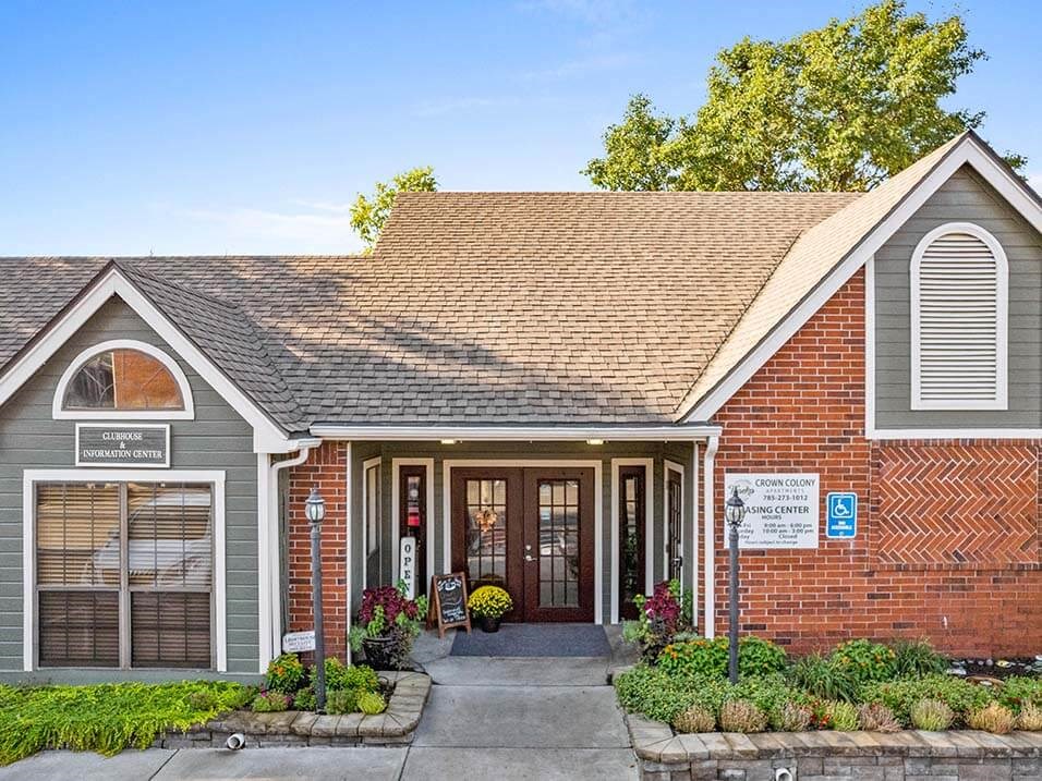 the front of a brick and with a porch
