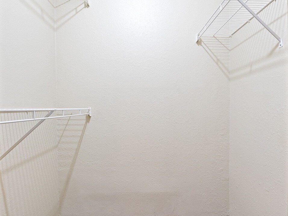 walk in closet in a bathroom with shelves