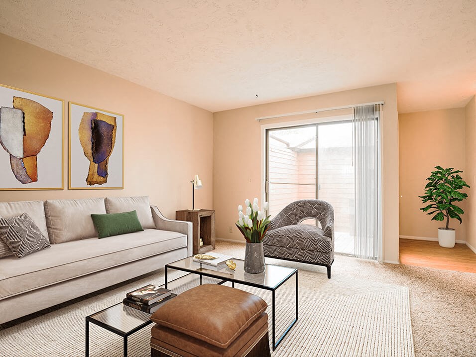 a living room with a couch chair and coffee table