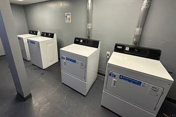 The laundry room at the club at cherry hills apartments