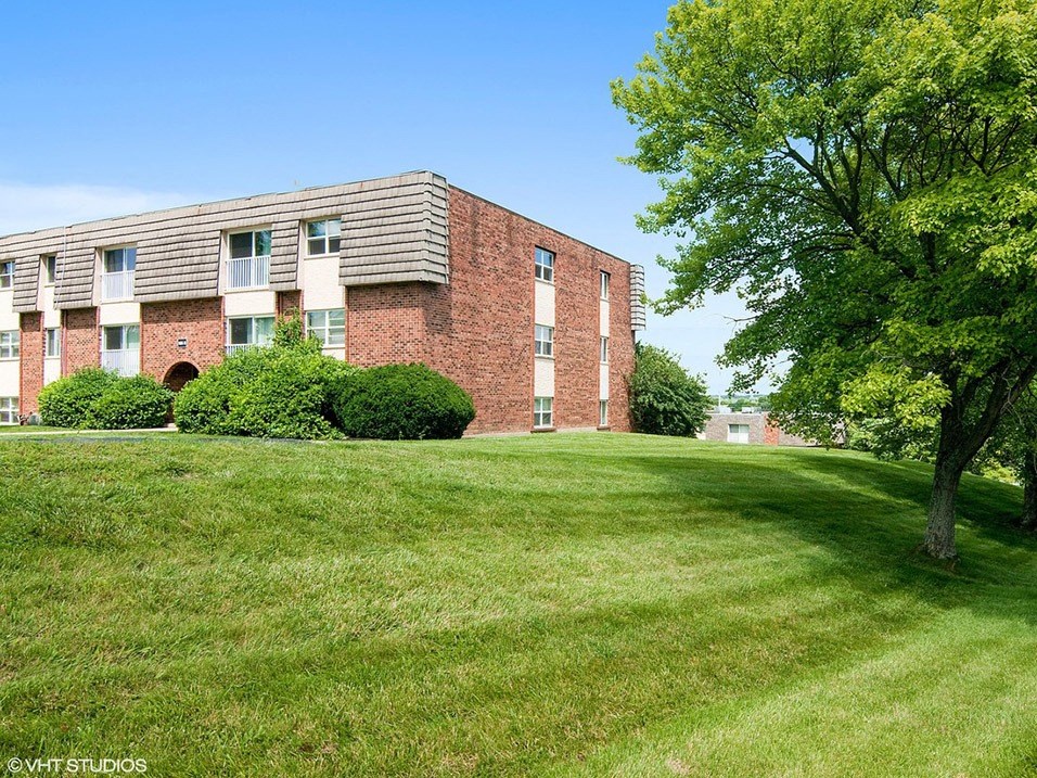 apartment complex with beautiful landscaping