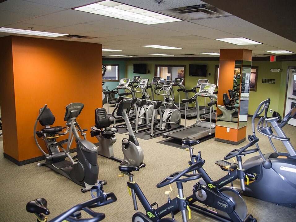 a room filled with lots of exercise bikes
