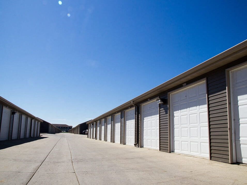 a row of garages on the side of a road