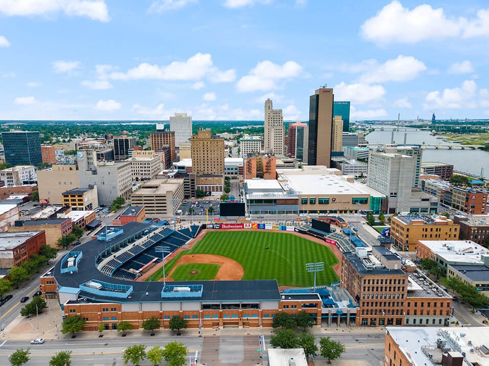 an aerial view of a baseball stadium in the city