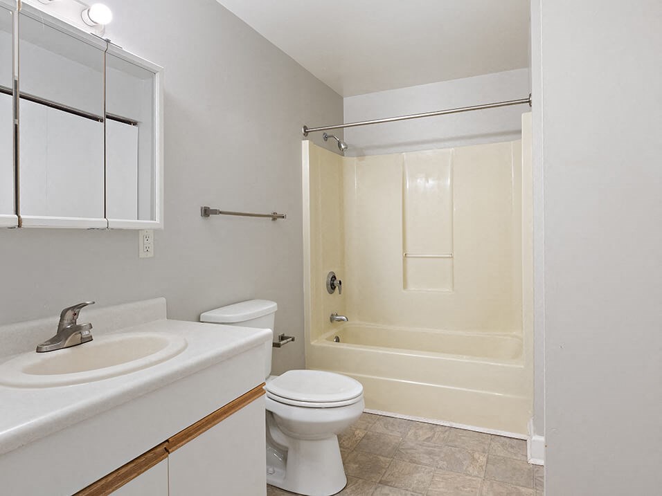 a bathroom with a sink toilet and a shower
