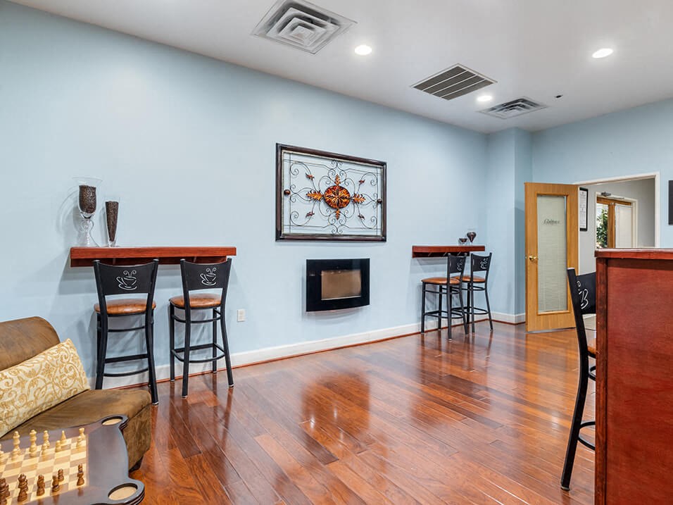 clubhouse with a bar and a fireplace