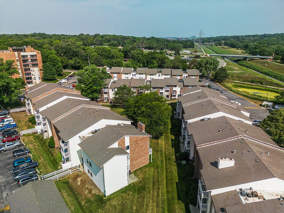 arial view of a housing complex with trees with Controlled Access