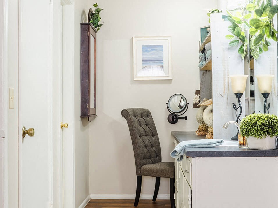 primary bedroom with a desk and chair