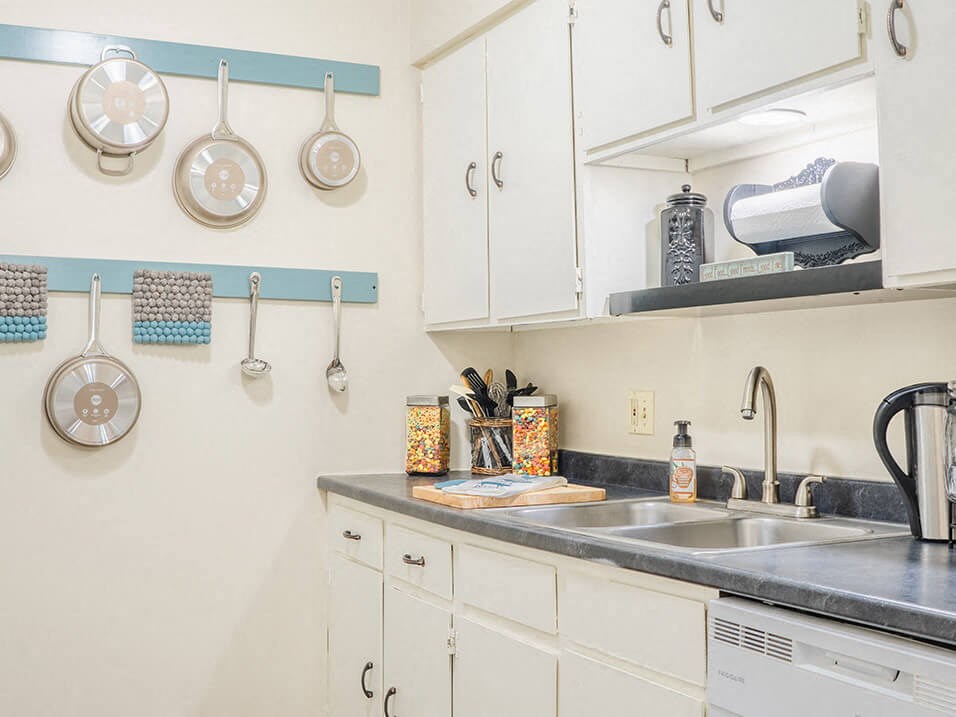 a kitchen with dishwasher and sink