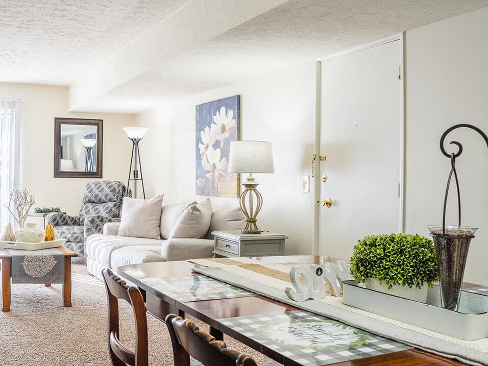 apartment living room filled with furniture and a large window