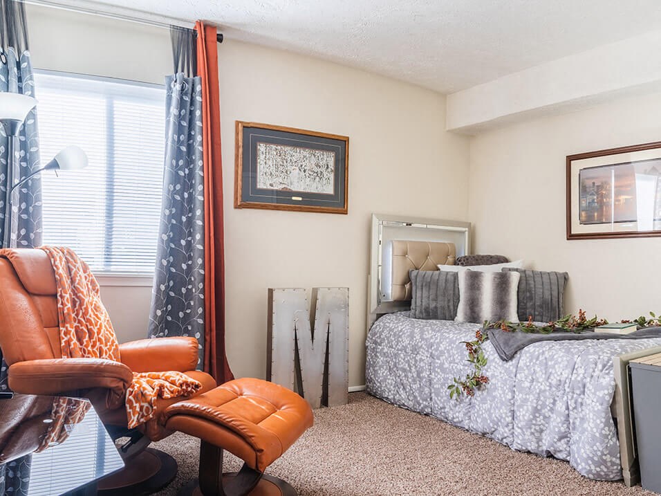 a bedroom with a bed and a window