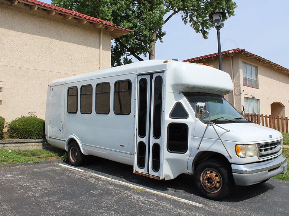 shuttle bus parked in a parking lot