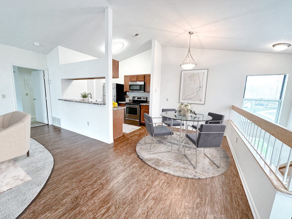 an open floor plan with a dining area and kitchen