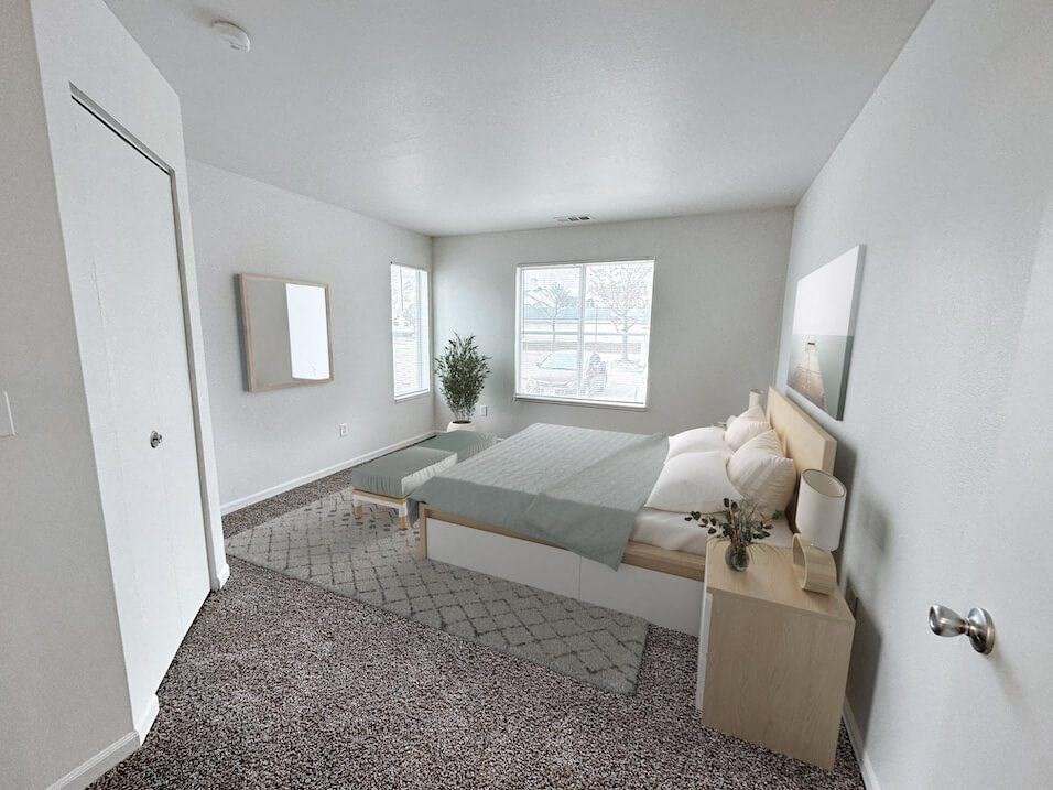 a bedroom with a bed and a window