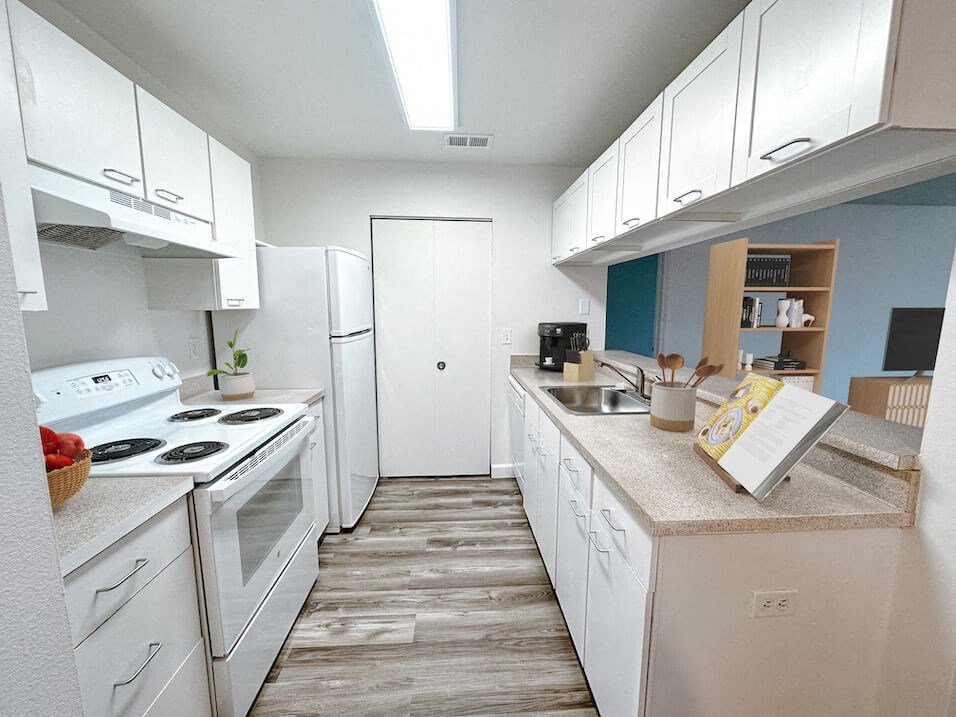 a kitchen with white appliances and white cabinets