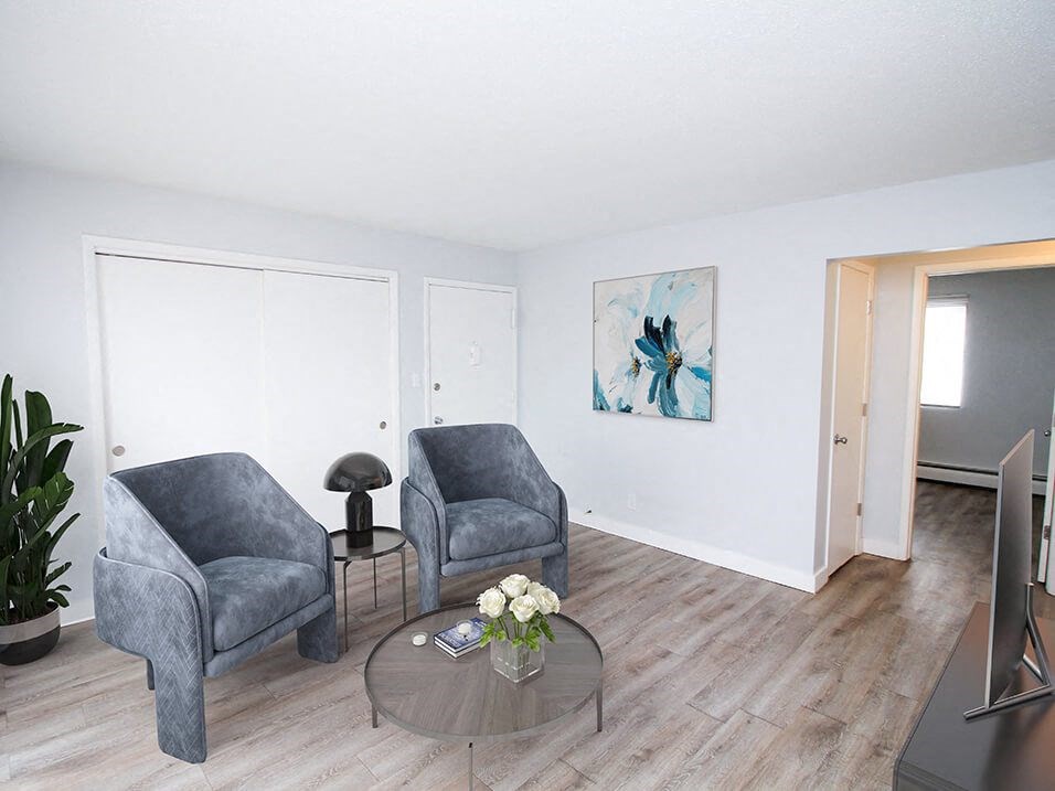 a living room with two chairs and a coffee table