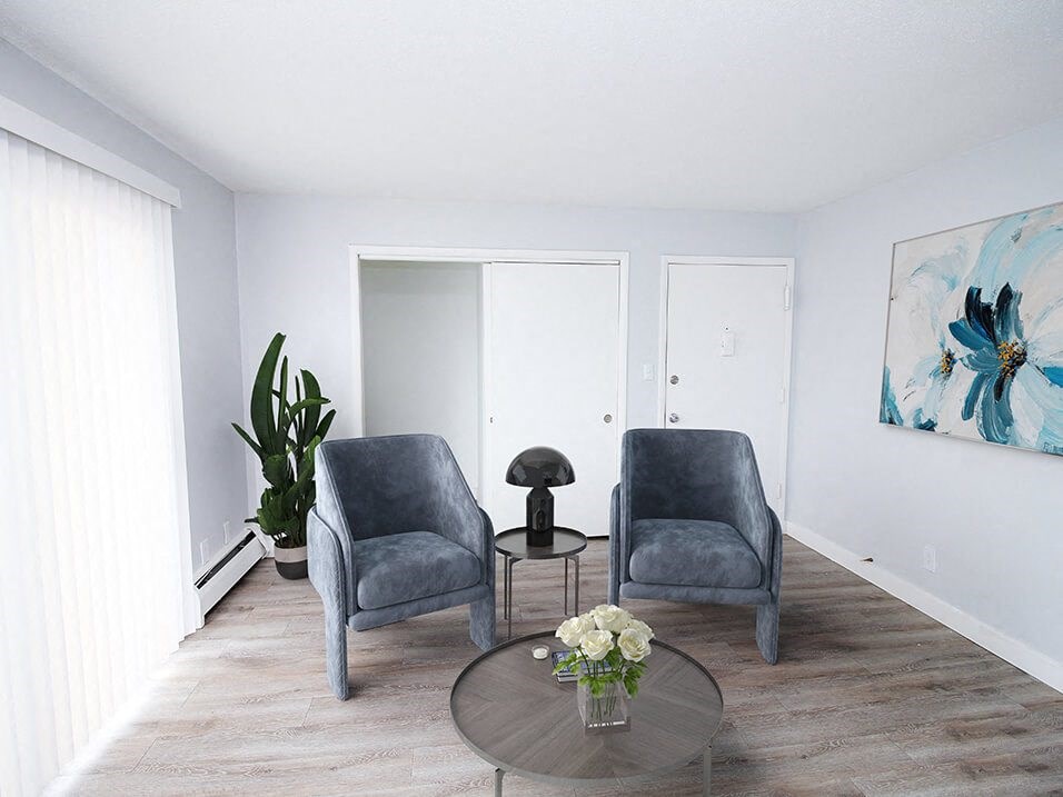 a living room with two chairs and a coffee table