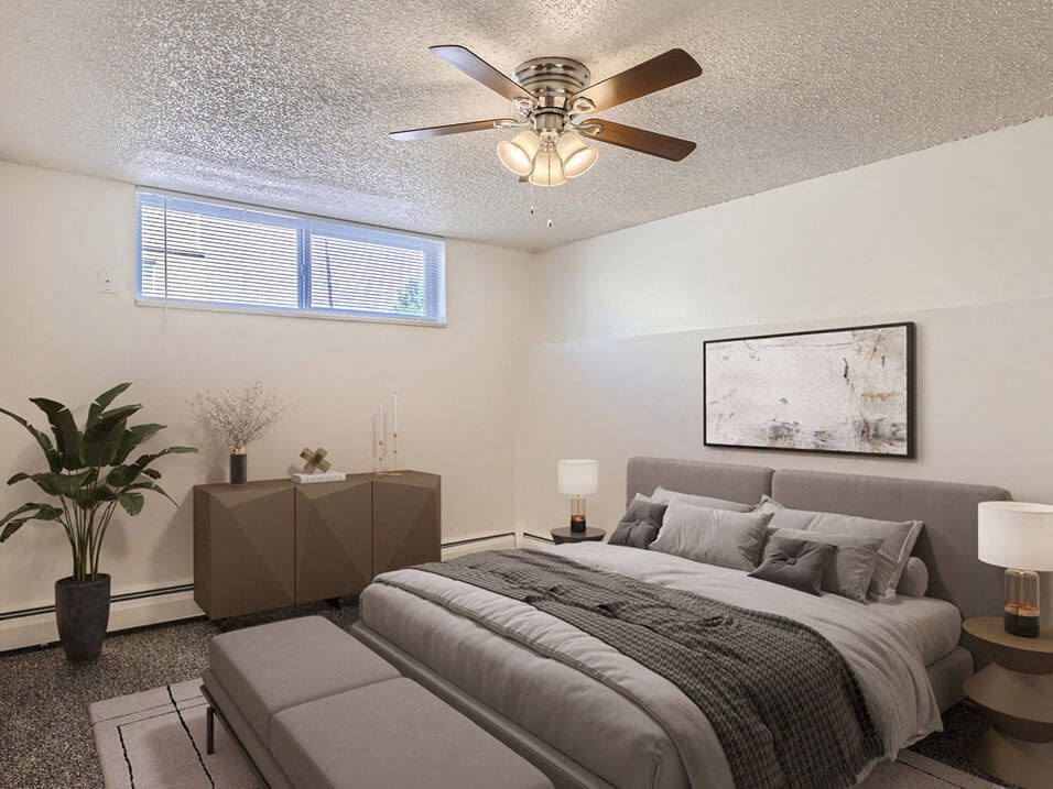 Bedroom with window and fan