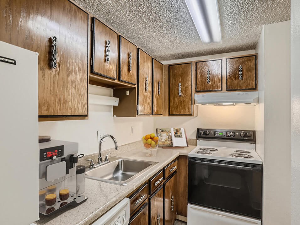 a kitchen with a sink and a stove
