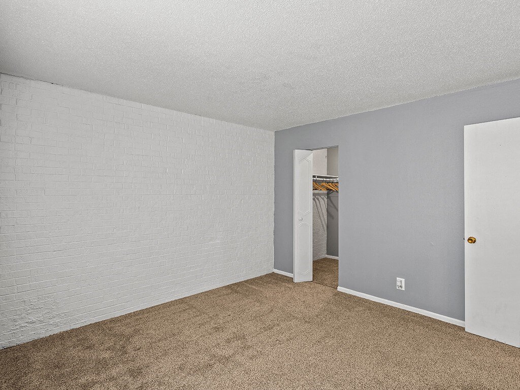 apartment bedroom with carpeting