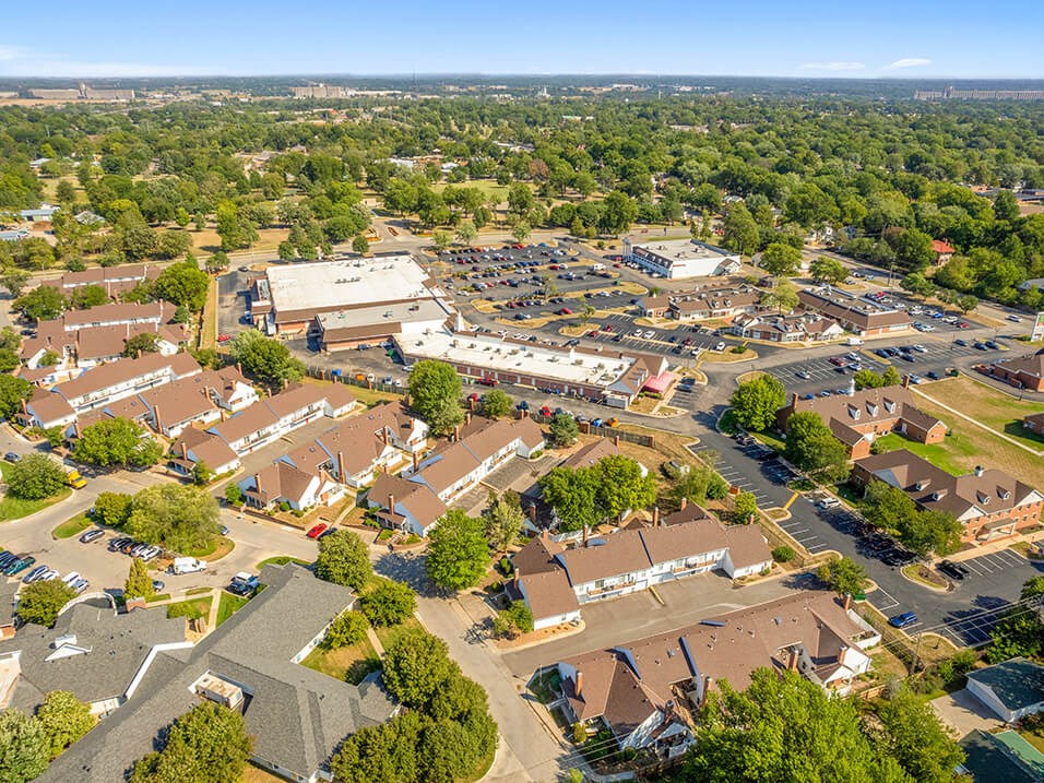 an aerial view of a suburban neighborhood with houses and trees